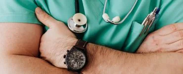 crop unrecognizable male doctor with stethoscope