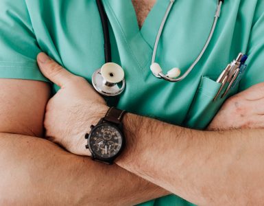 crop unrecognizable male doctor with stethoscope
