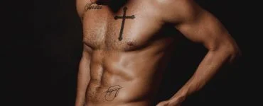 a tattooed man in his underwear